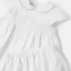 Babykjole i broderet bomulds-poplin