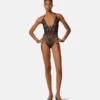 Broderet bodysuit med blondekant