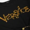 Crop-T-shirt med sikkerhedsnål og nitter