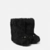 Gianni Ribbon Shearling Boots