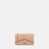 Kleio quiltet nappa mini-taske