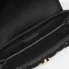 Kleio quiltet nappa mini-taske