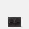 La Medusa-pyntet satin-clutch