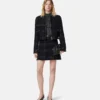 Ribstrikket top i lurex-blanding